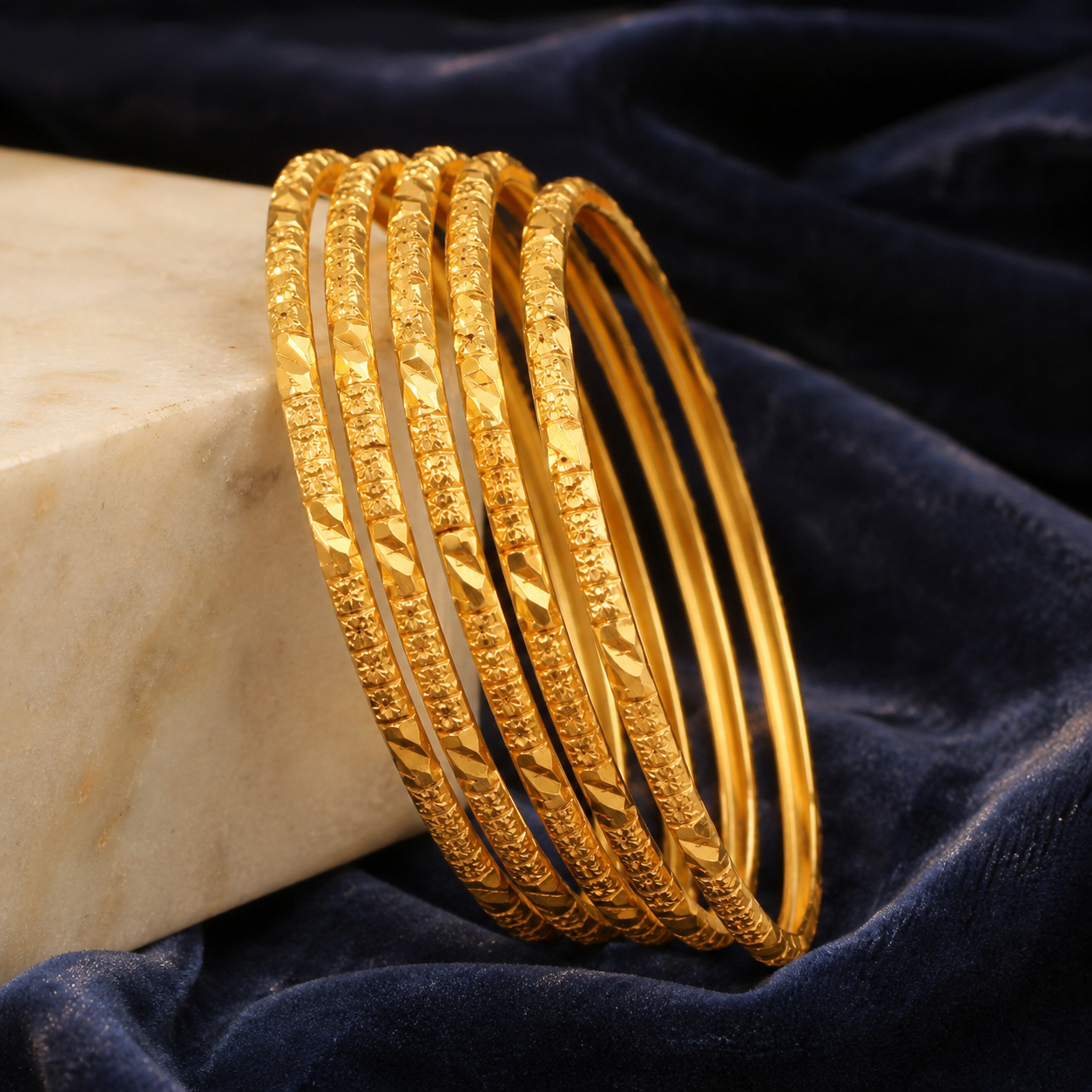 Set of six engraved gold covering bangles